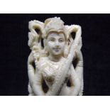 Hindu or Sino Tibetan - Miniature Bone Carving on Wooden Base. Four Armed Deity Playing Instrument