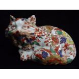 Chinese Famille Rose Cat - Pottery with White Enamel ground, overpainted flowers and buds. In