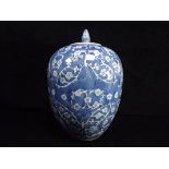 Large Chinese Ovoid Blue and White Lidded Butterfly Jar. Prunus or Apple Blossom branches forming