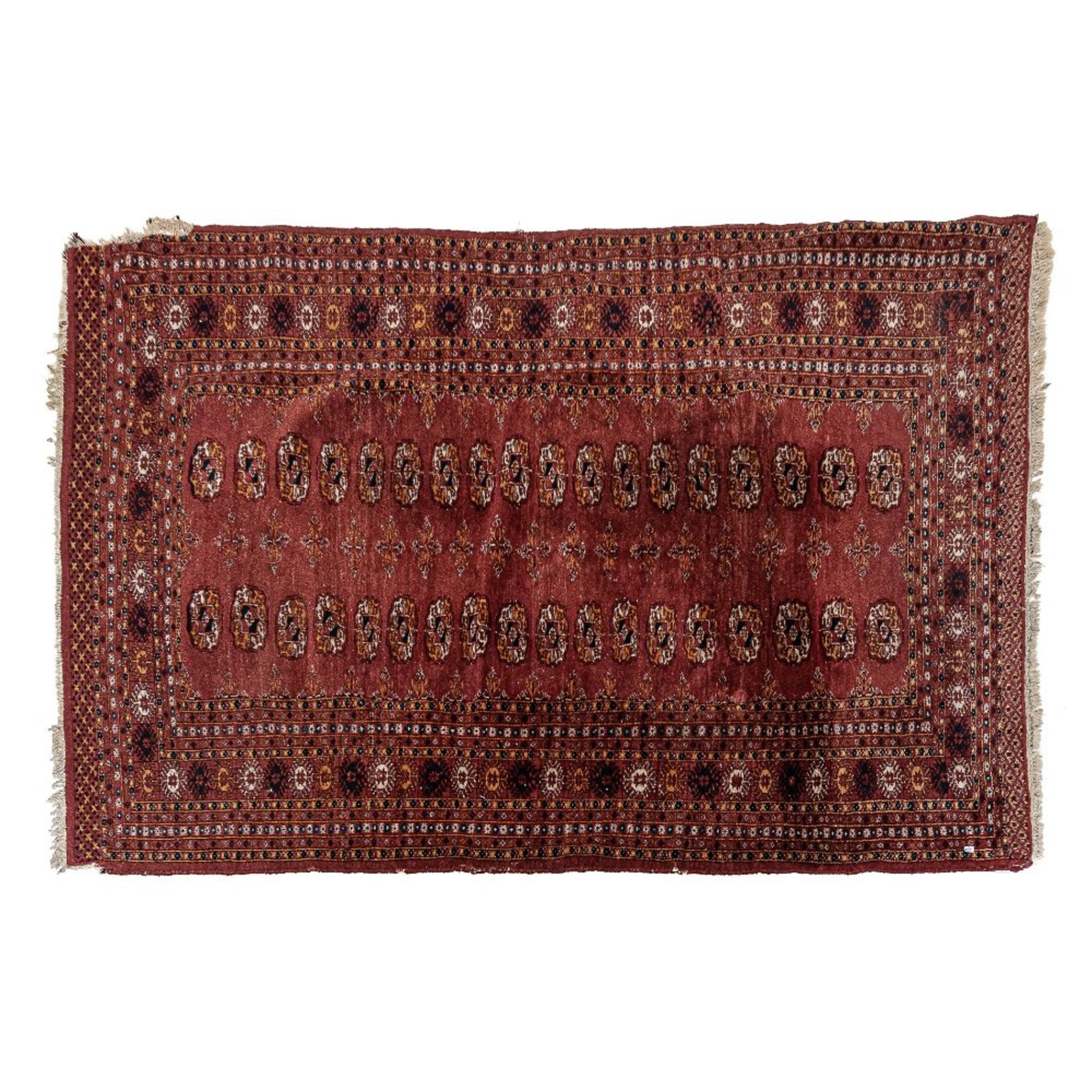Alfombra oriental en lana anudada a mano con decoración geométrica, s.XX.