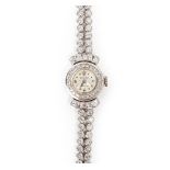 Rolex, reloj de pulsera para señora en platino con diamantes.
