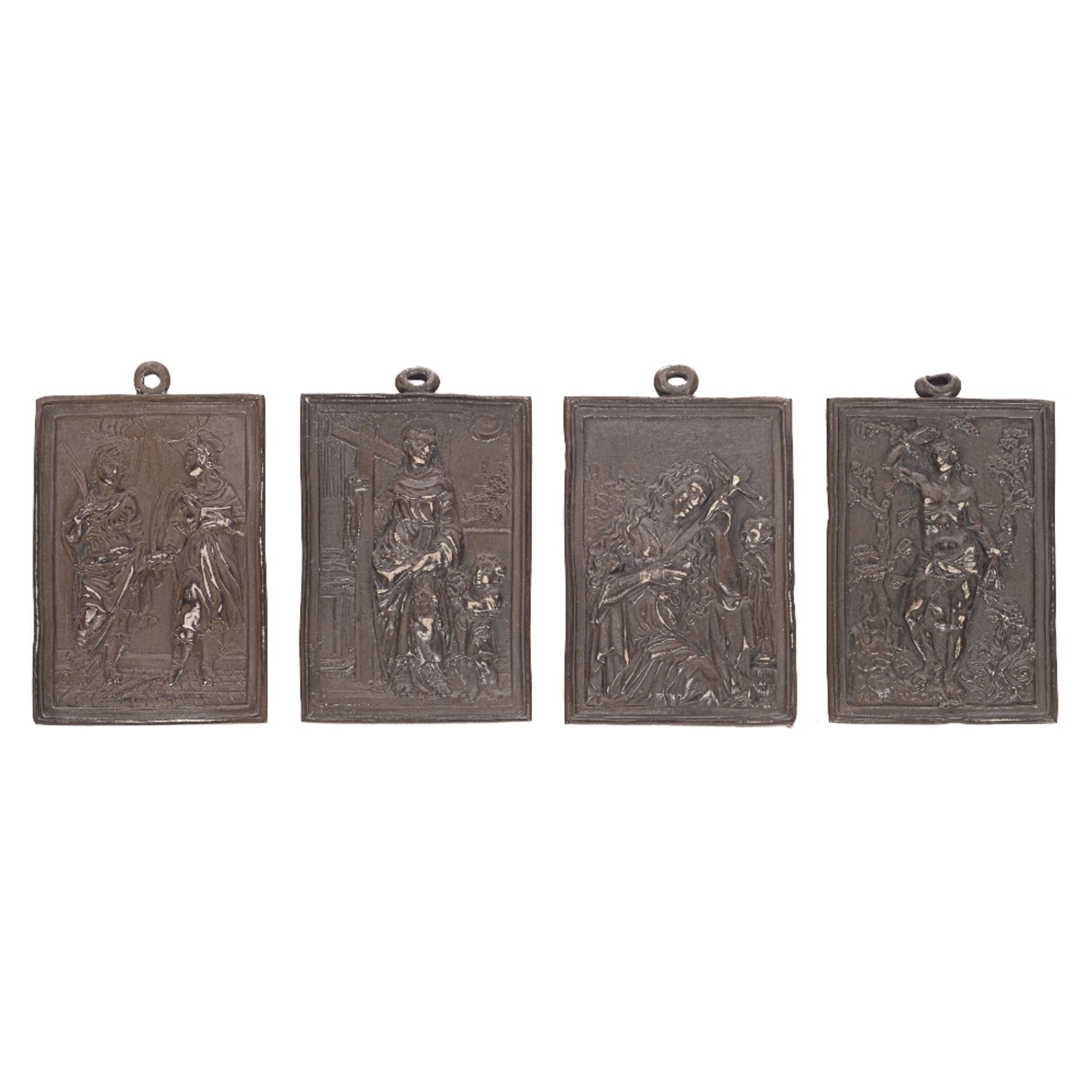 Lote de cuatro placas devocionales en plata patinada. España, s.XVIII-XIX.
