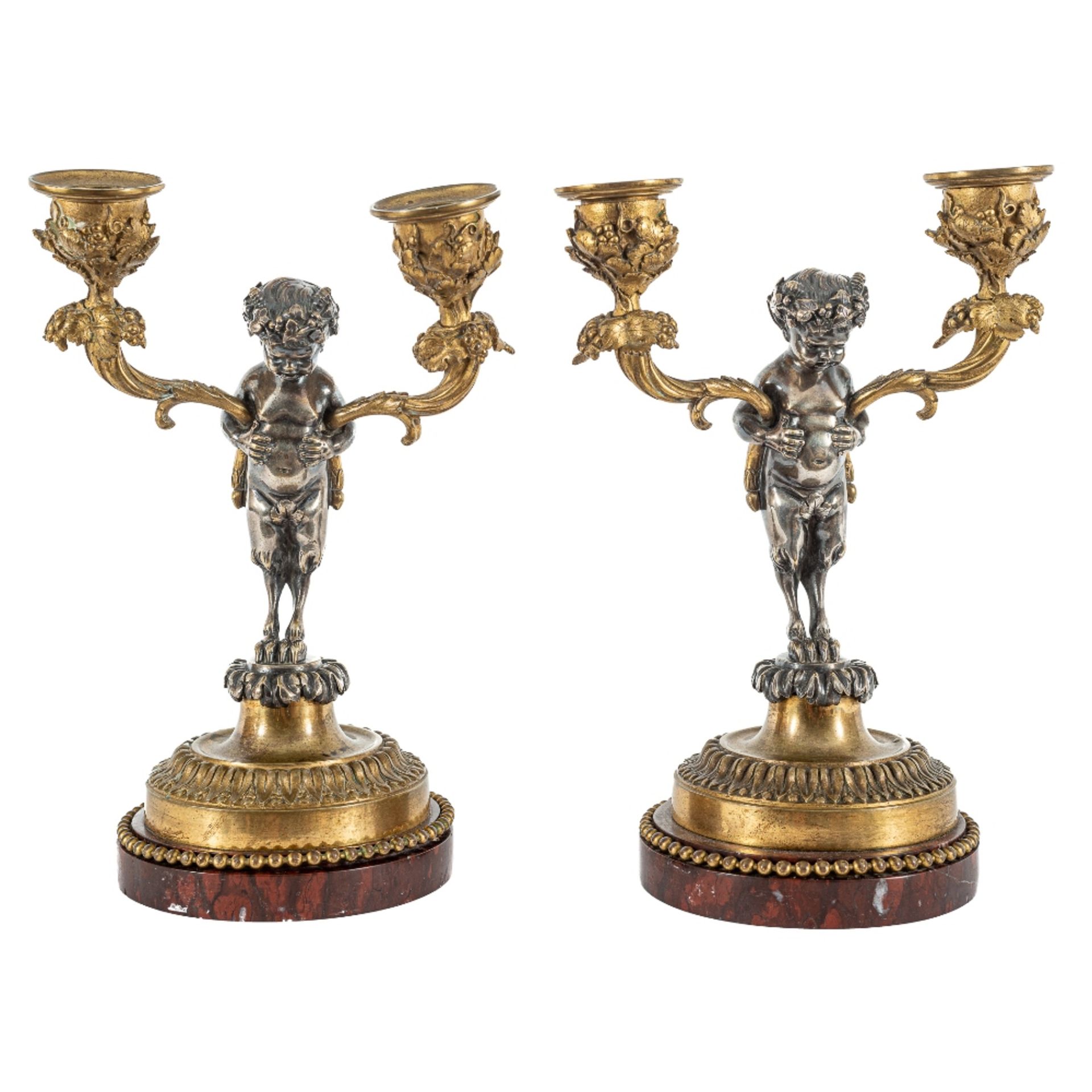 Pareja de candelabros de dos luces en bronce plateado y dorado. Francia, s.XIX. 