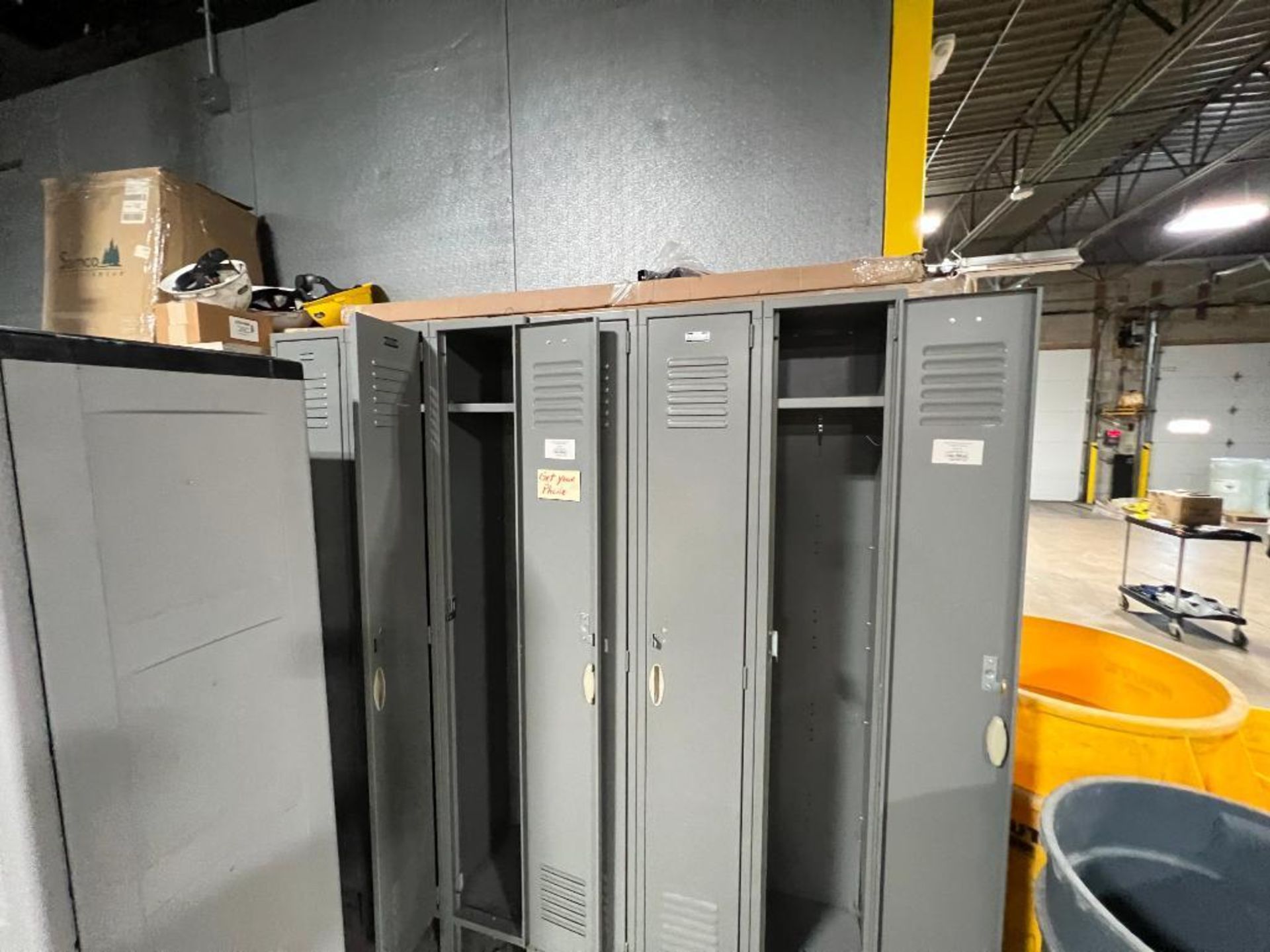 Assorted bays of lockers, two door plastic cabinet, and two door metal cabinet