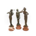 Trio of 7" bronze female figures on marble bases