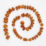 Butterscotch amber tumbled bead necklace individually knotted 113g 30" long