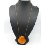 Large lump of amber - butterscotch colour - on chain 39g