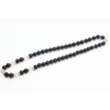 9ct gold onyx & rock quartz beads single strand necklace (33.9g)