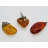 3x Amber and silver pendants 12.1g total weight