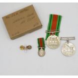 Medals awarded to Mrs. Mac Phail and a US Air Force Pilot's badge marked sterling