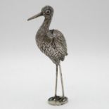 Silver stork with heraldic seal to feet and wings open up to contain matches