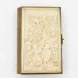 5" x 3.5" family church services book dated 1910 with highly carved ivory frontpiece and back
