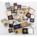 Box containing medals and badges