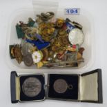 Box containing military buttons, badges and medals