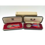 Set of boxed Elizabeth II Imperial Service medals to Raymond Albert Sutton and Felix McCuster