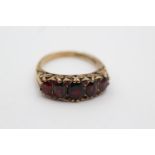 9ct gold five stone garnet gypsy set ring, as seen (4.9g) Size P