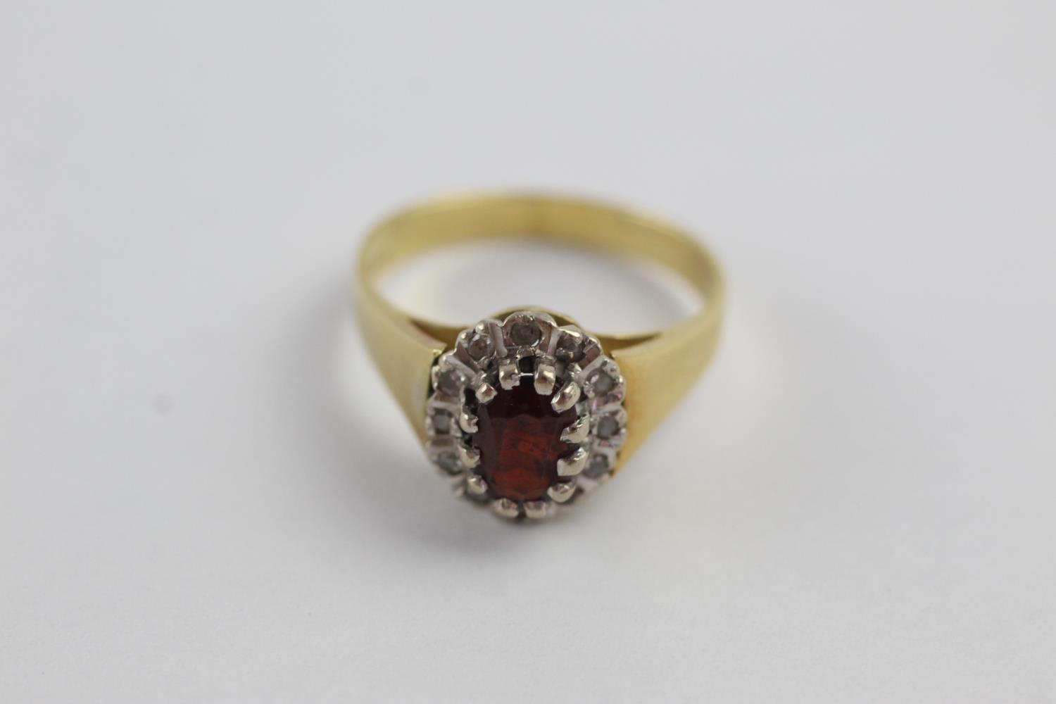 18ct gold garnet & diamond halo ring (4.8g) size N