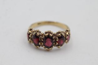 9ct gold garnet five stone gypsy set ring (3.7g) size N