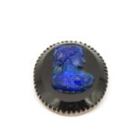 850 Silver brooch with black onyx background with cast blue glass lady's head with foil backing