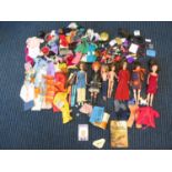 Large collection of tressy dolls and an action girl with a large amount of clothing