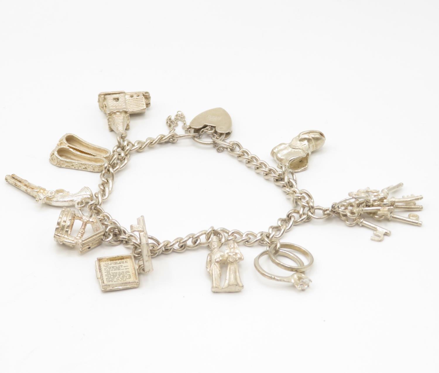 Silver charm bracelet 36.4g