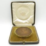 Boxed medal in bronze 70mm diameter 146.3g with original velvet inlay and leather covered box