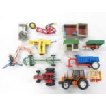 Box of played with Britains farming equipment