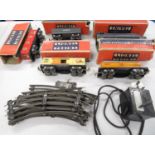 Collection of Lionel Corporation track and transformer - some boxed