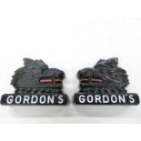 A pair of 8 inch Gordons Gin advertising glass griffins - left and right