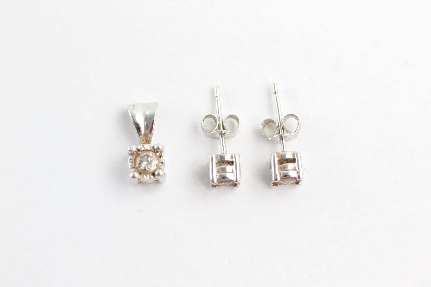 2 x 9ct white gold diamond pendant and stud earrings set (1.8g)