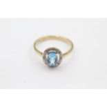 9ct gold diamond framed topaz ring (2g) size O