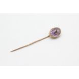 15ct gold head antique amethyst stick pin with 9ct gold pin (2.1g)