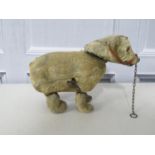 A german clockwork muzzled bear with key - fully working. 6inches long