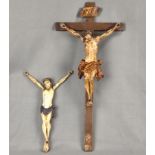 Zwei Christus-Kreuze, je als 3-Nageltypus, einer an Kreuz, 62x29cm, einer ohne Kreuz, 35x21cm, poly