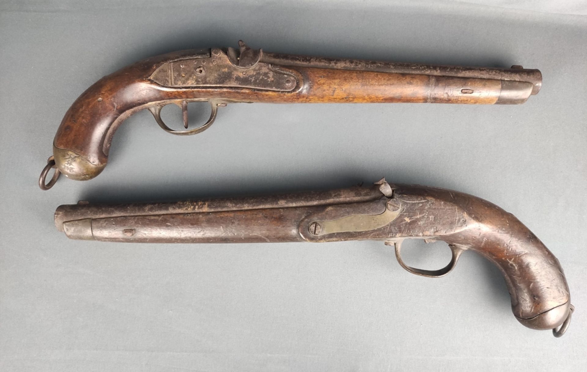 Paar Duellpistolen, runder Lauf, Vollholzschaft mit Eisenbeschlägen, eine mit "KH B46, C43" markier