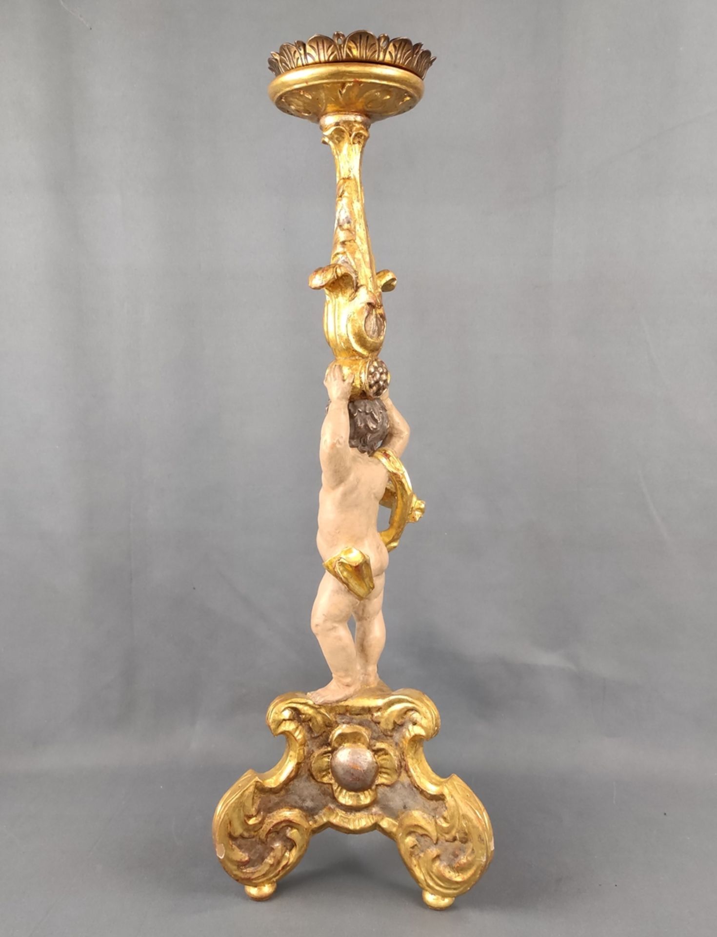 Large wooden candlestick in baroque style, carved, three-legged base with putto carrying profiled a - Image 2 of 5