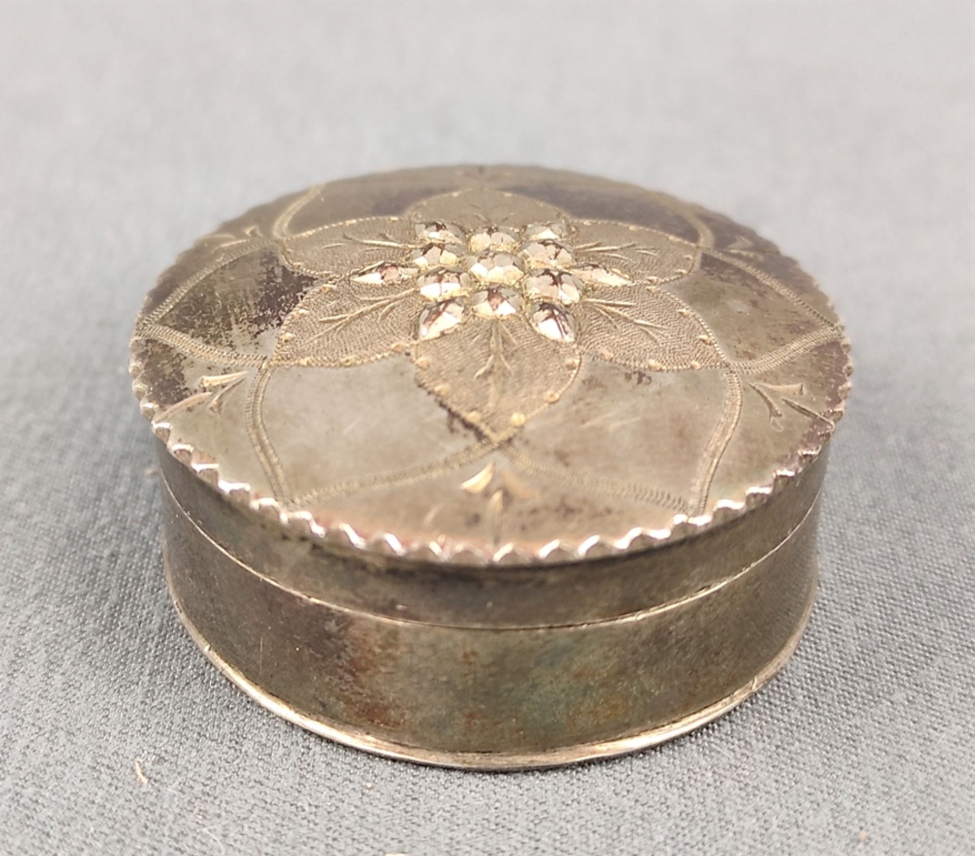 Antique pillbox decorated with flower and set with marcasites, silver, hallmarked with "S" in shiel