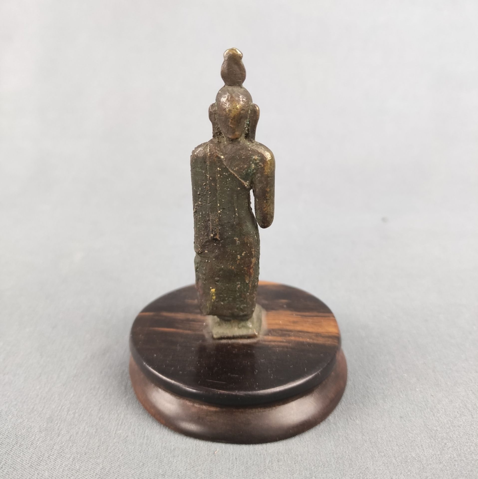 Small Buddha figure, probably Ceylon, probably 17th century, bronze on small round base, height 10. - Image 3 of 3