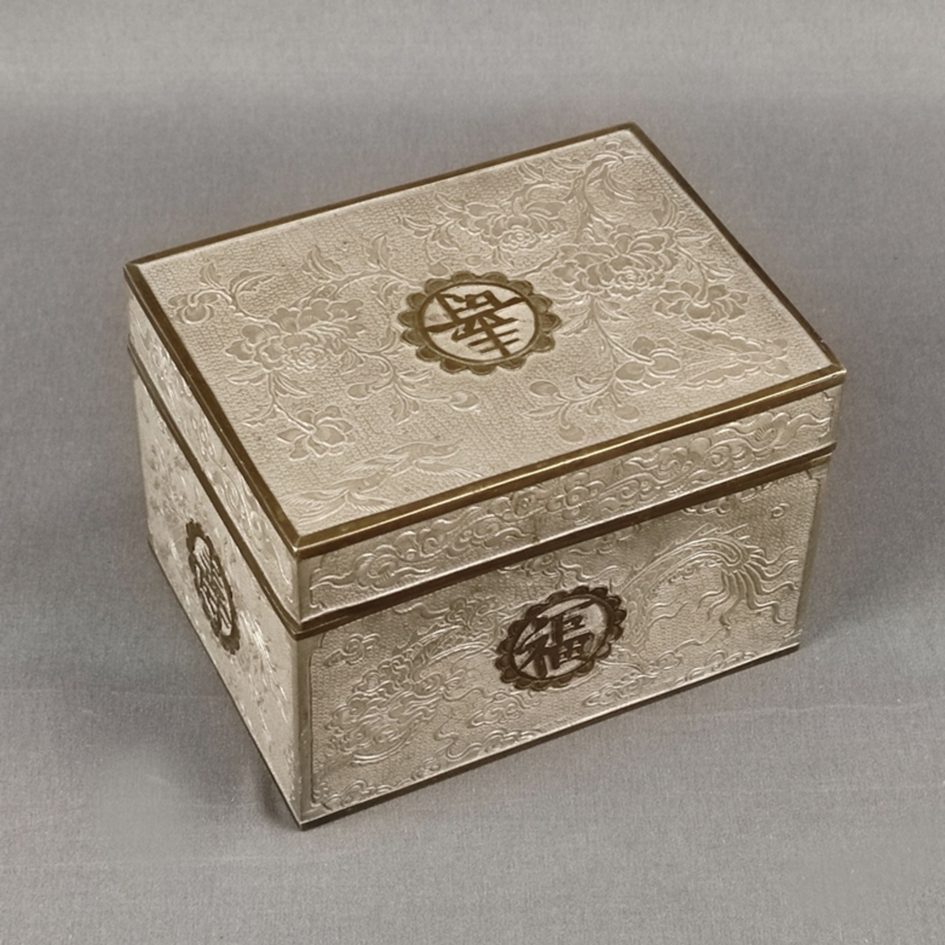 Tea caddy, China, pewter, relief decoration with floral motives and dragons, on each side writing c