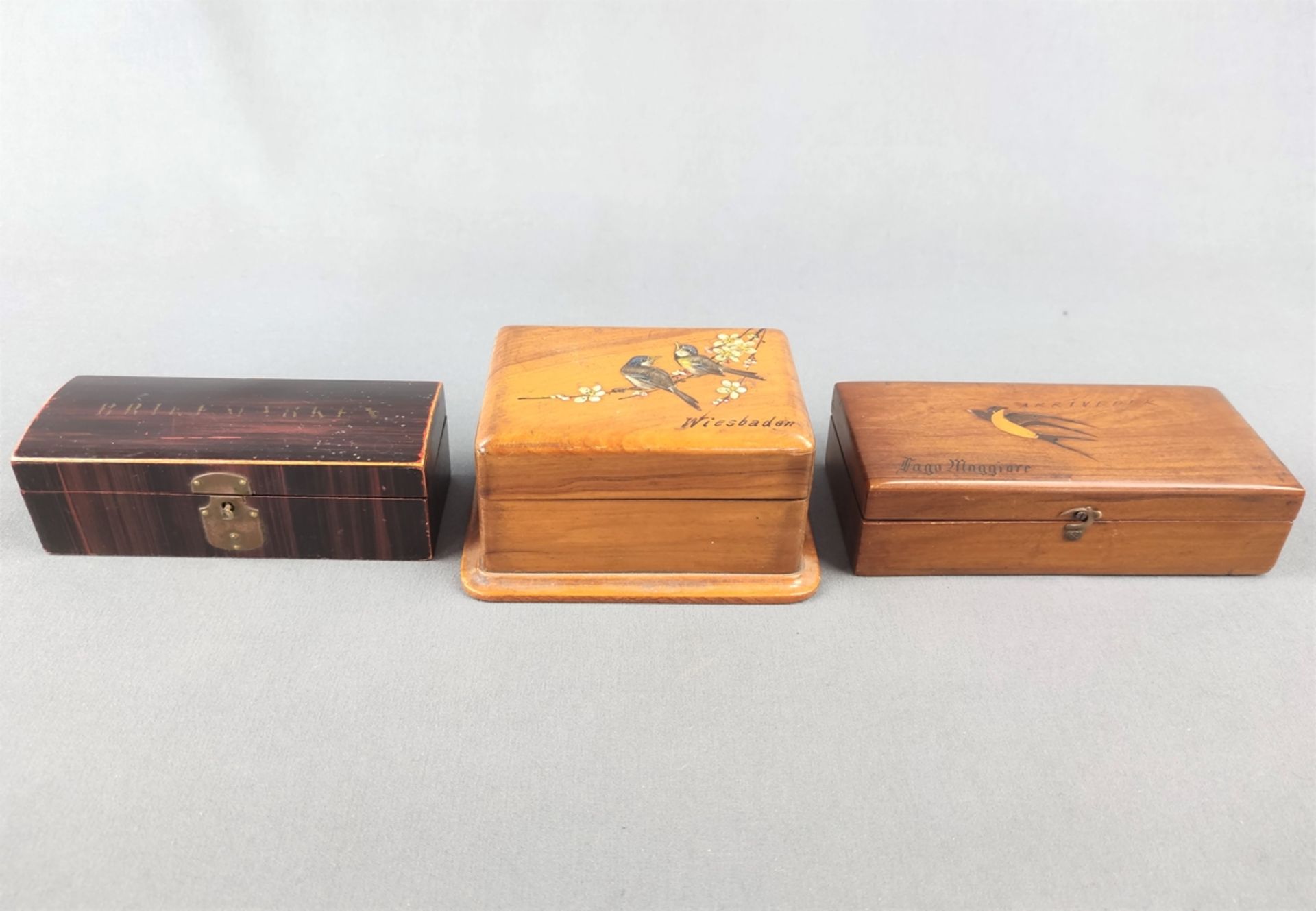 Set of three small wooden caskets, one rectangular hinged for stamps, with inscription "Briefmarken