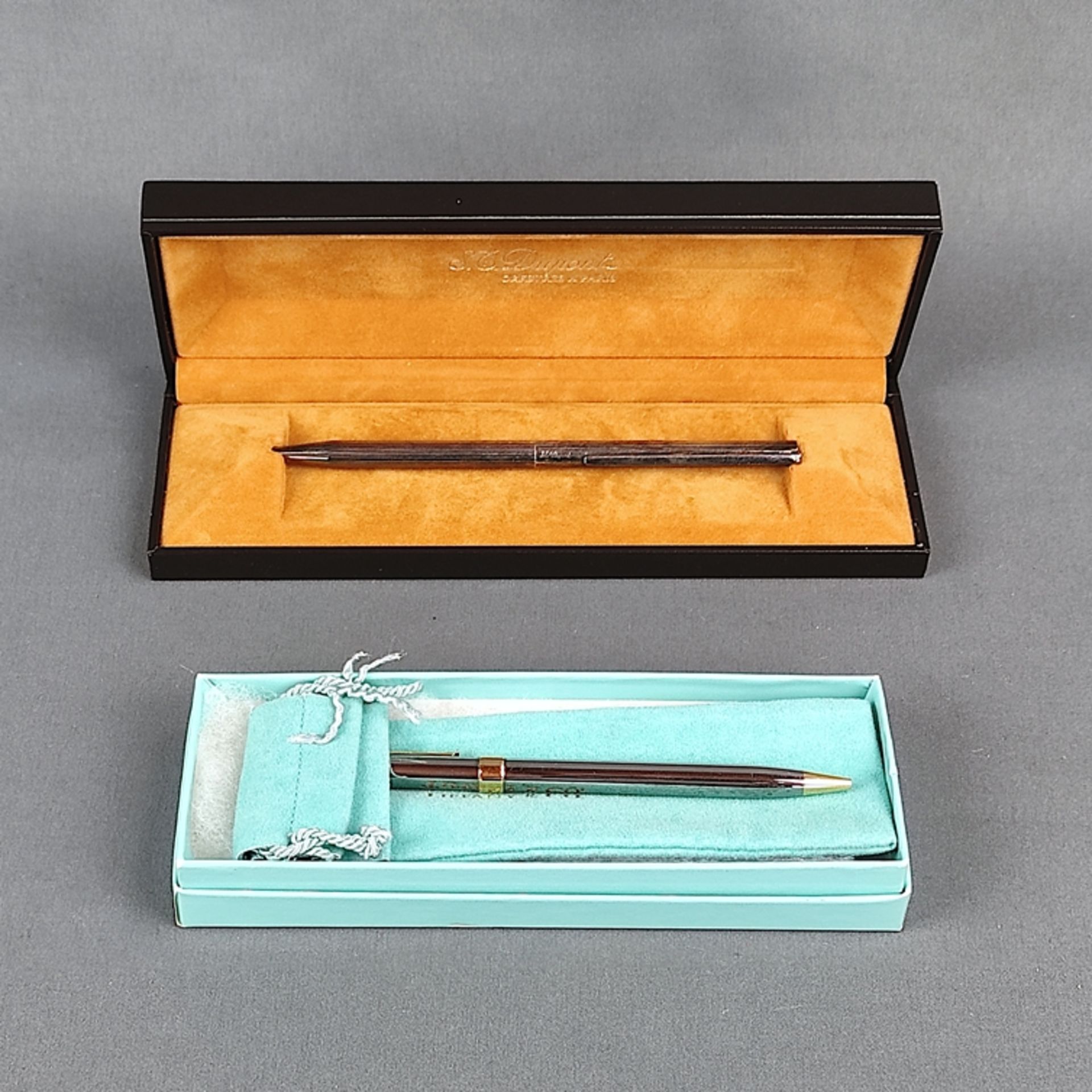 Two writing utensils, Tiffany & Co. and S.T. Dupont, consisting of a twist ballpoint pen, bicolour,