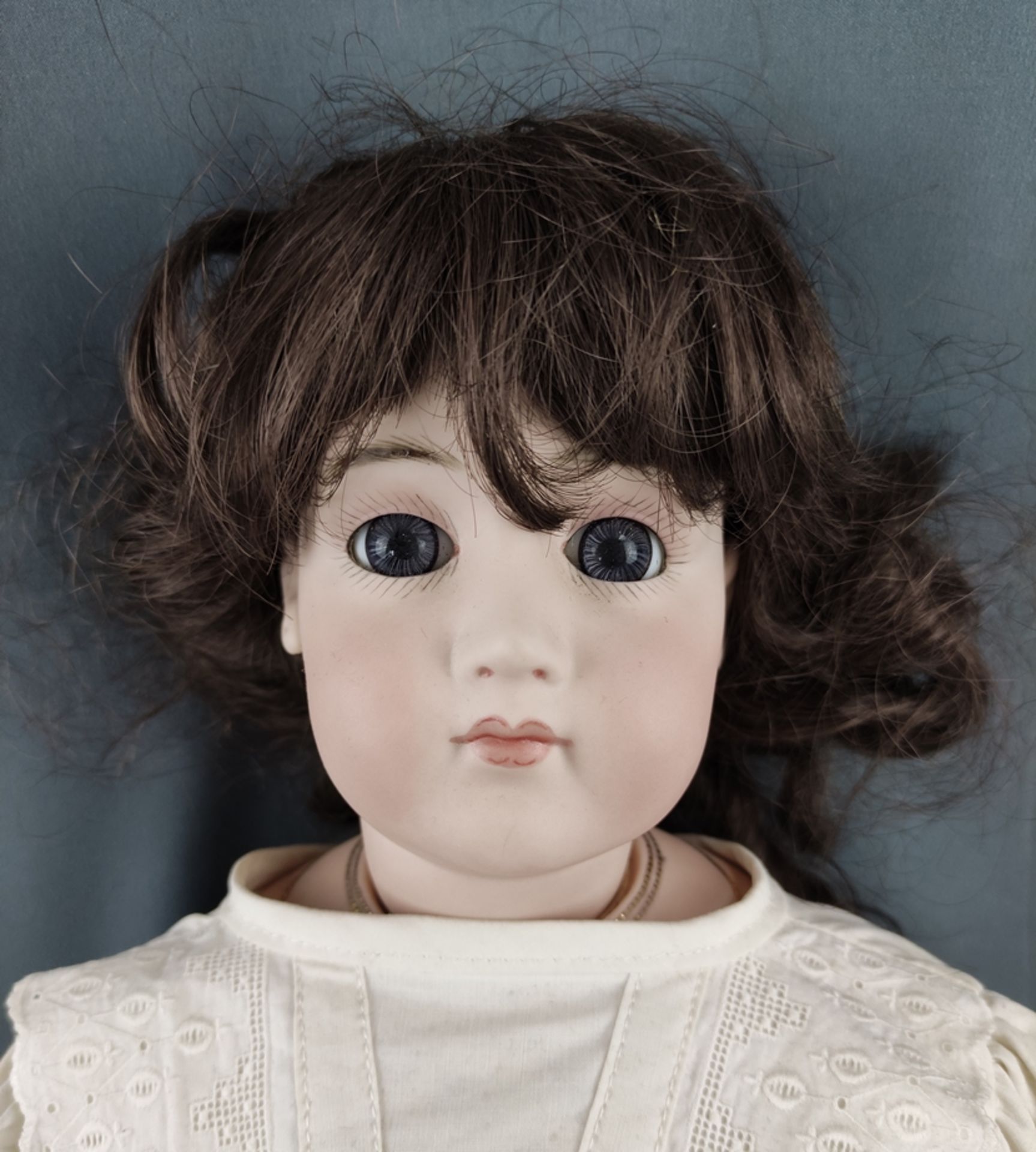 Two dolls, one with blue glass eyes, closed mouth and brown curly wig, head and hands made of bisqu - Image 4 of 5