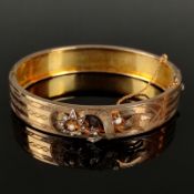 Antique bangle, 19th century, gold plated, central floral decoration with small seed pearls, pin cl