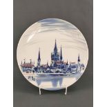 A plate with the silhouette of Constance, in the centre the Constance Cathedral, painted in blue, l