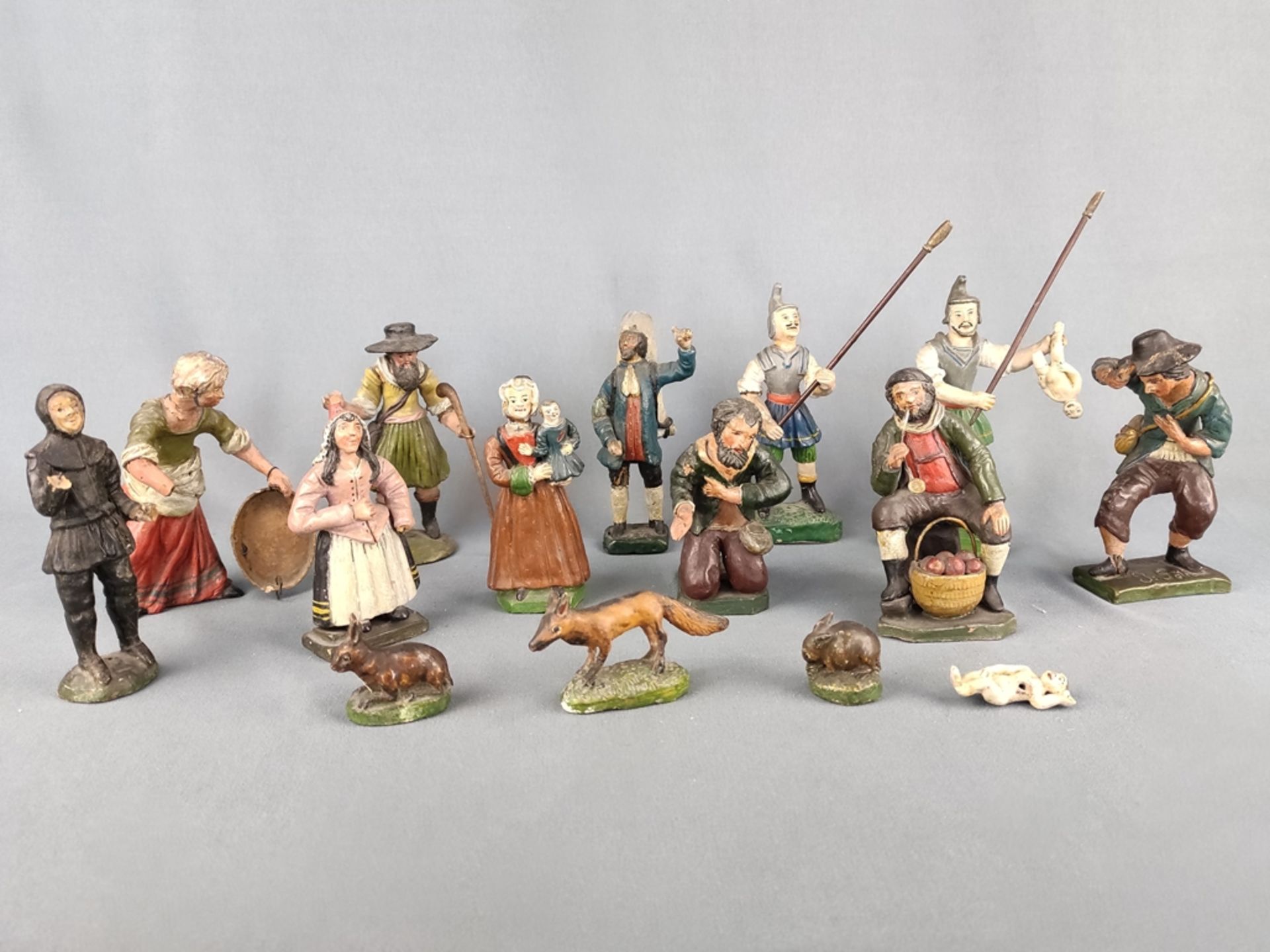15 figurines, 19th century, terracotta, colourfully painted, one signed on base J: Göth., height of