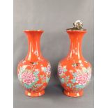 Pair of vases, China, bulbous body with elongated neck and slightly flared opening, orange backgrou