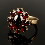 Antique garnet ring, circa 1900, tombac setting set with central garnet as cabochon surrounded by a