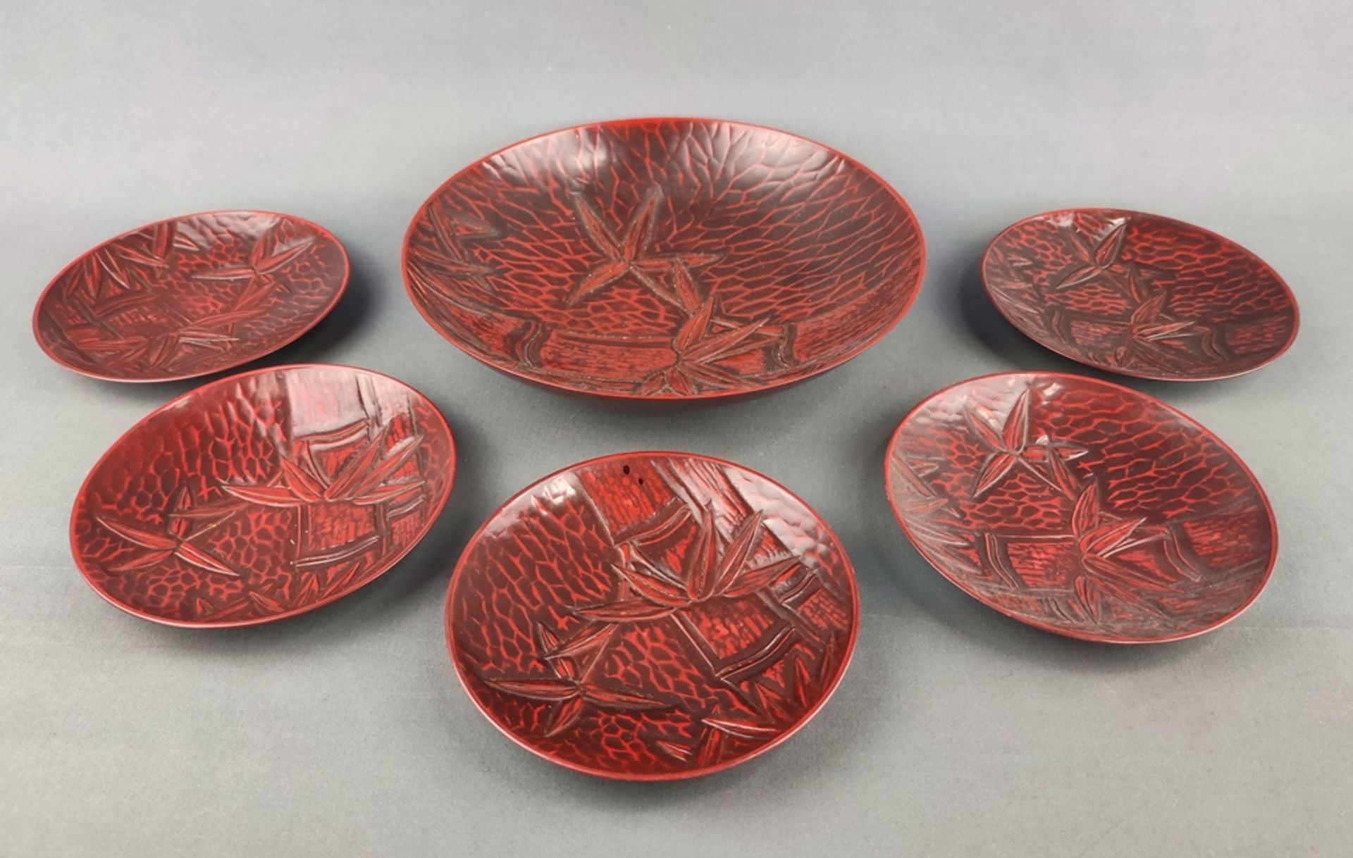 Red lacquer set, 6 pieces, Japan, consisting of a bowl, height 4.5cm and diameter 21cm and five sma