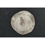 An English Civil War Coin, by Charles 1st. On the obverse: Crowned and bearded bust of Charles I,