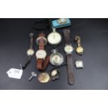 A selection of 8 vintage watches which includes 2 stop watches & a vintage mid century tin plated